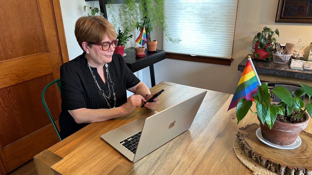 Karen Block work at her computer inside her home office