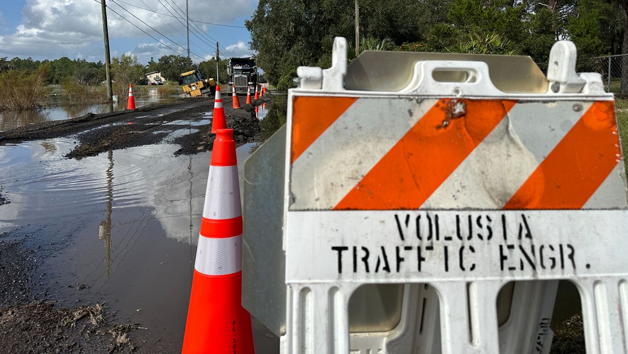 Crews in Volusia County work to restore access in the area of Miller Road. This is a spot that still has leftover flooding following Hurricane Milton. (Spectrum News/Devin Martin)