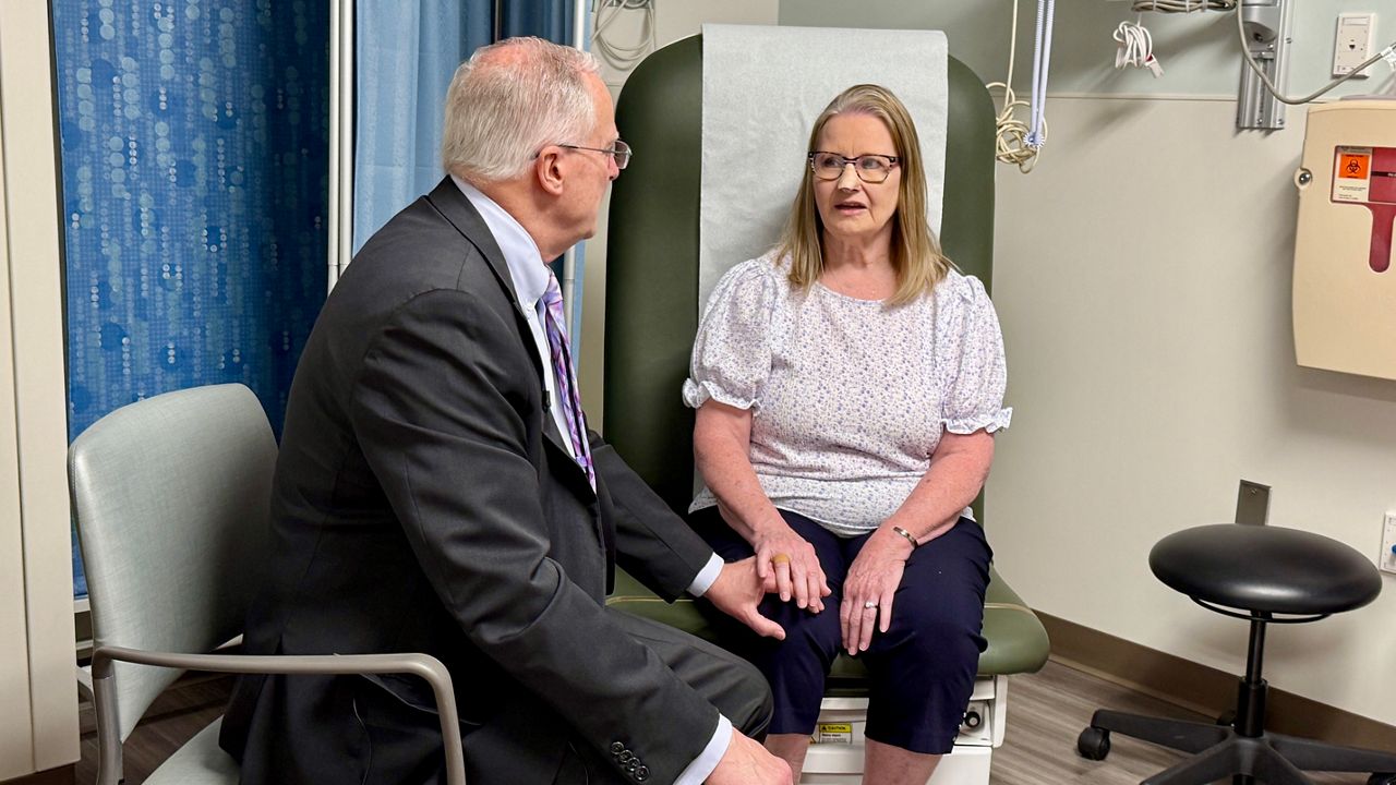 Brenda Gotlen speaks to Dr. Thomas Rutherford, the Tampa General doctor that saved her life. (Spectrum News/Erin Murray)