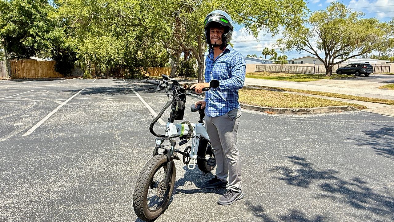 Cess Colindres now has new tires, a new helmet and reflective tap on his e-bike after a very bad crash. (Spectrum Bay News 9/Erin Murray)