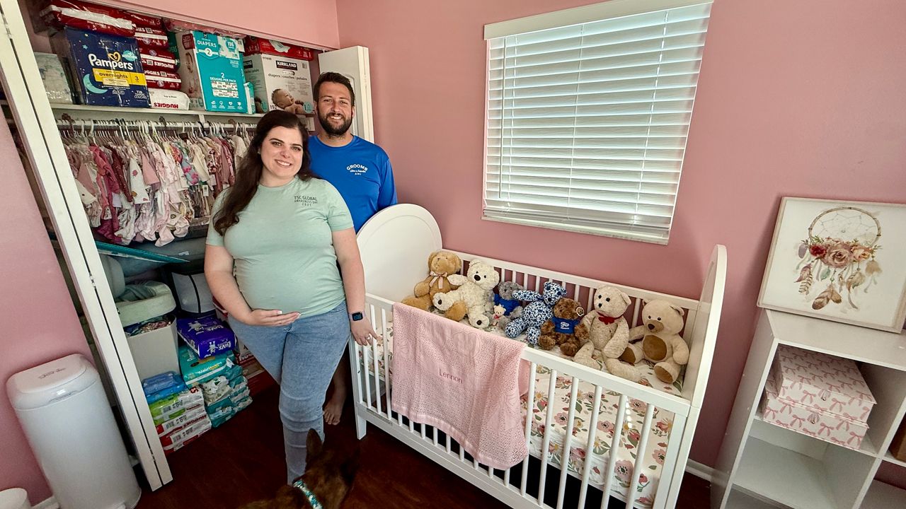 Megan Self and her husband are excited to bring a baby girl into the world. They just found out she will be born with TSC. Photo: Erin Murray