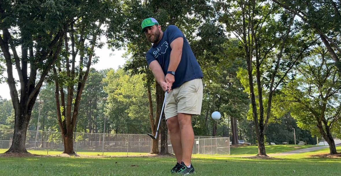 Daniel Legge practicing his swing.