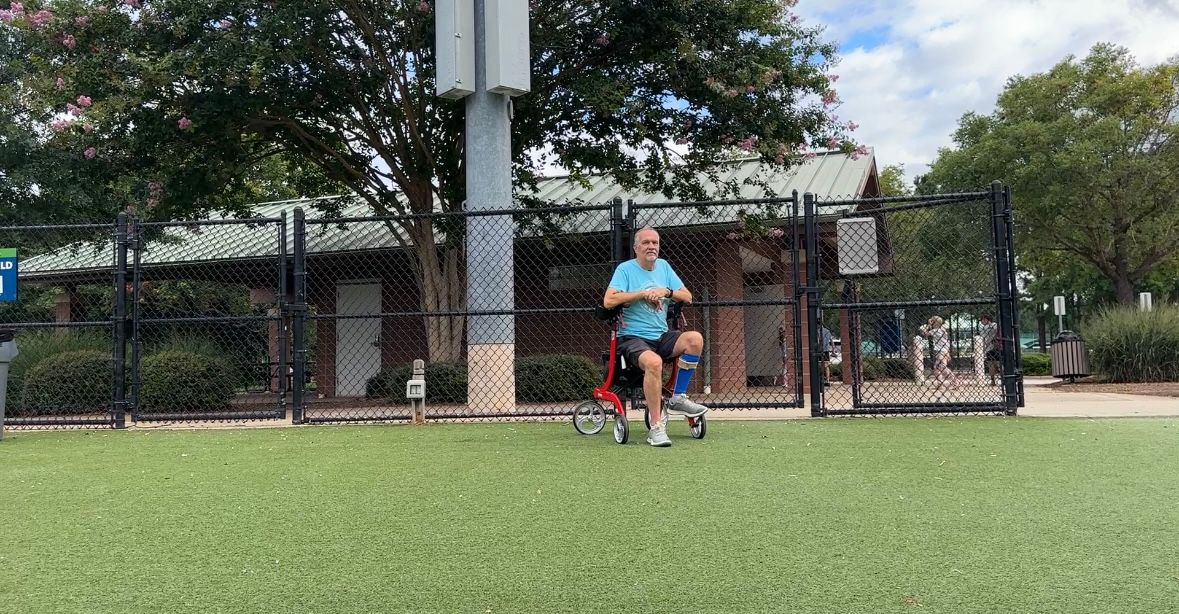 Larry Falivena watching sports practice.