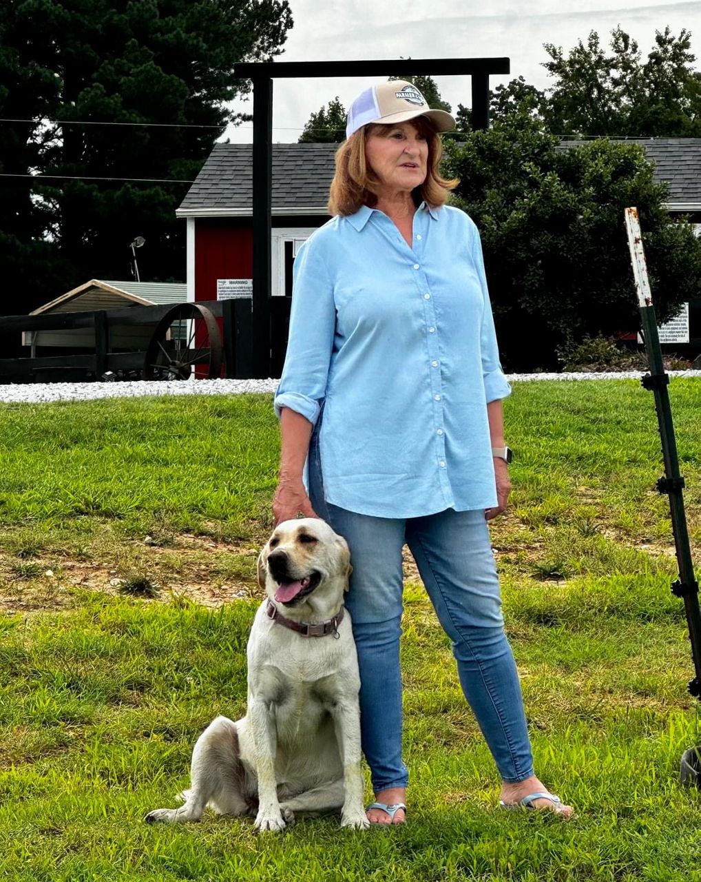 Faylene Whitaker looks over the farm with her dog. (Courtesy: Faylene Whitaker)