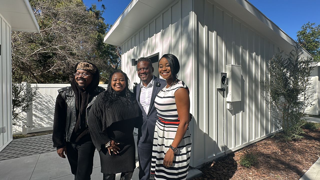 Pastor Mark T. Jones (shown with his family) remained committed and determined as he established the first tiny home village for homeless veterans in east Tampa. After over two years, the Manifestations Worldwide Inc. Church celebrated the grand opening of ‘Manifest Veterans Village’ on Friday.