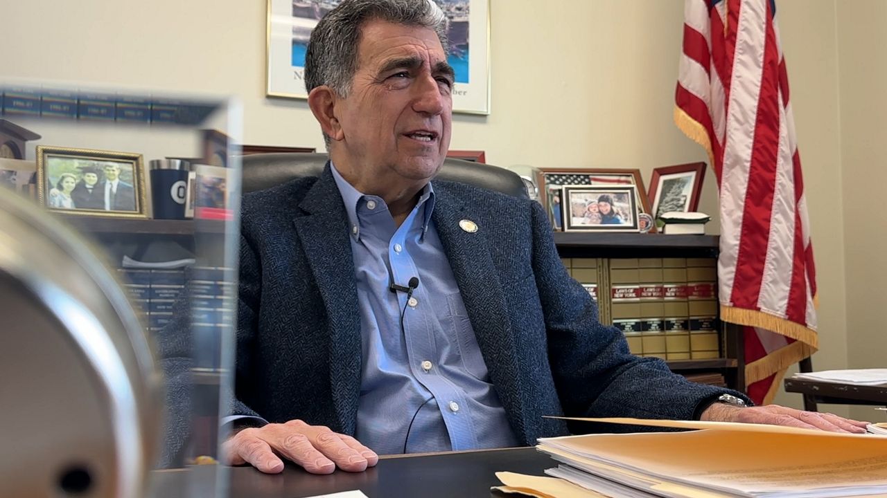 Bill Magnarelli sits at his desk