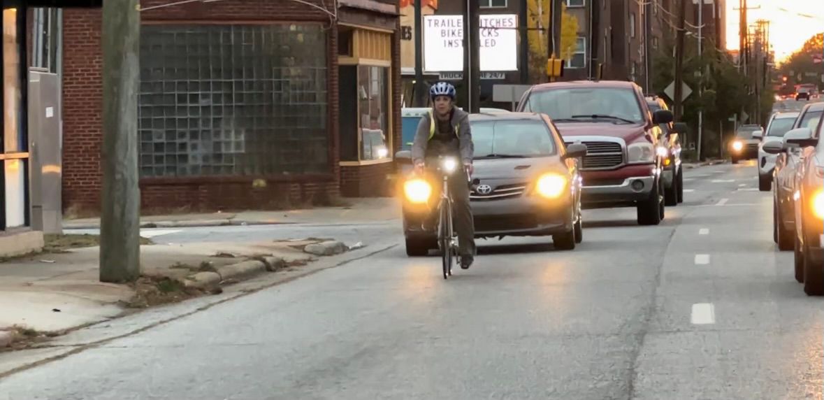 Lindahl riding her bike on the road in Greensboro.