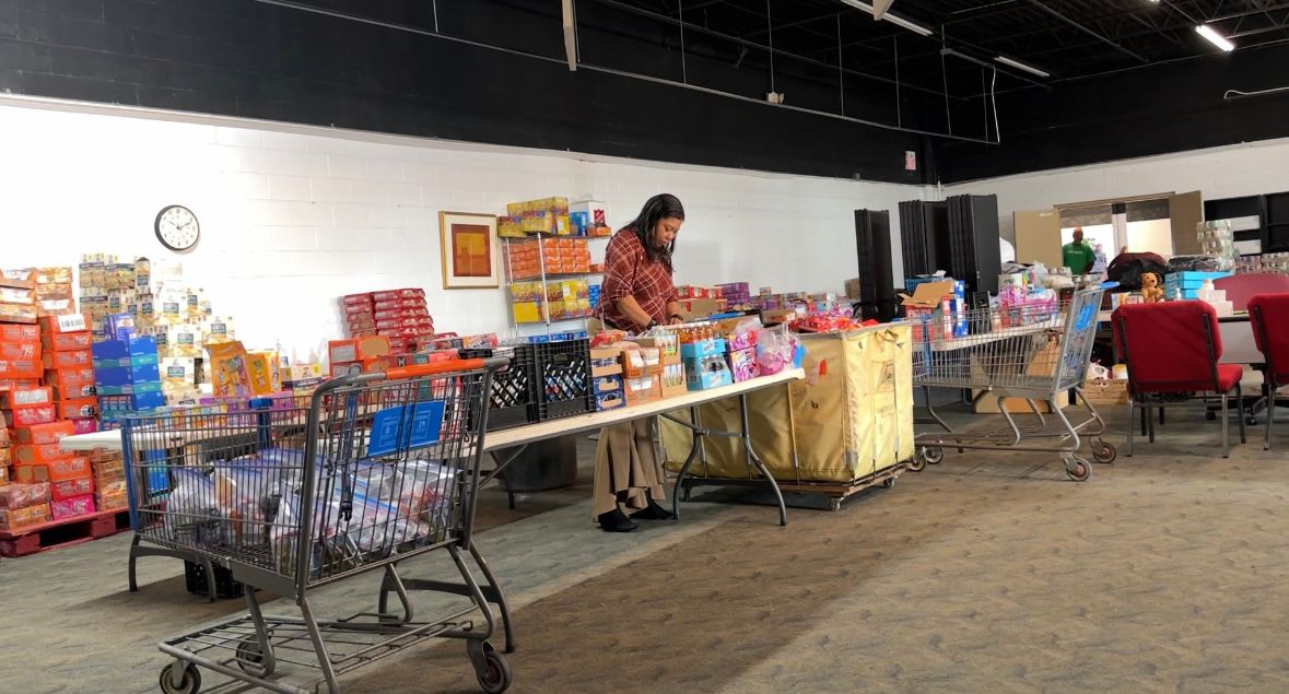 Latoya Bullock packing bags for their Backpack Program.