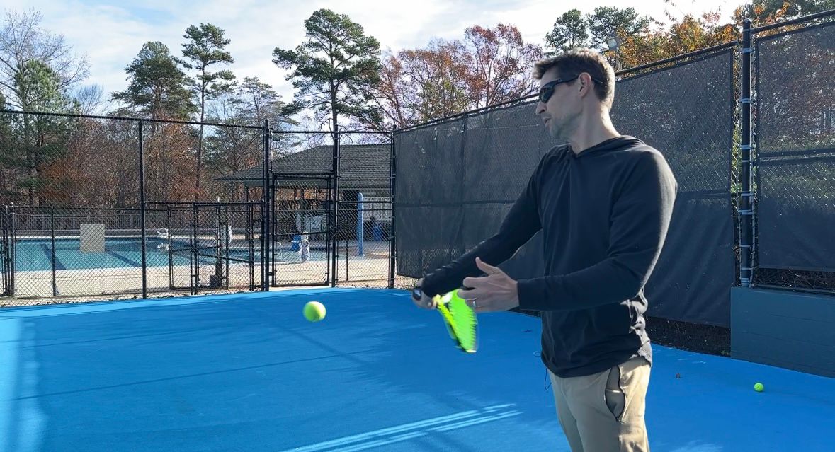 Jeff Fusaiotti plays tennis in Greensboro.