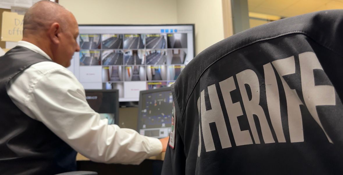 Sheriff Mike Roberson, looking at courthouse cameras. (Sydney McCoy/ Spectrum News 1)
