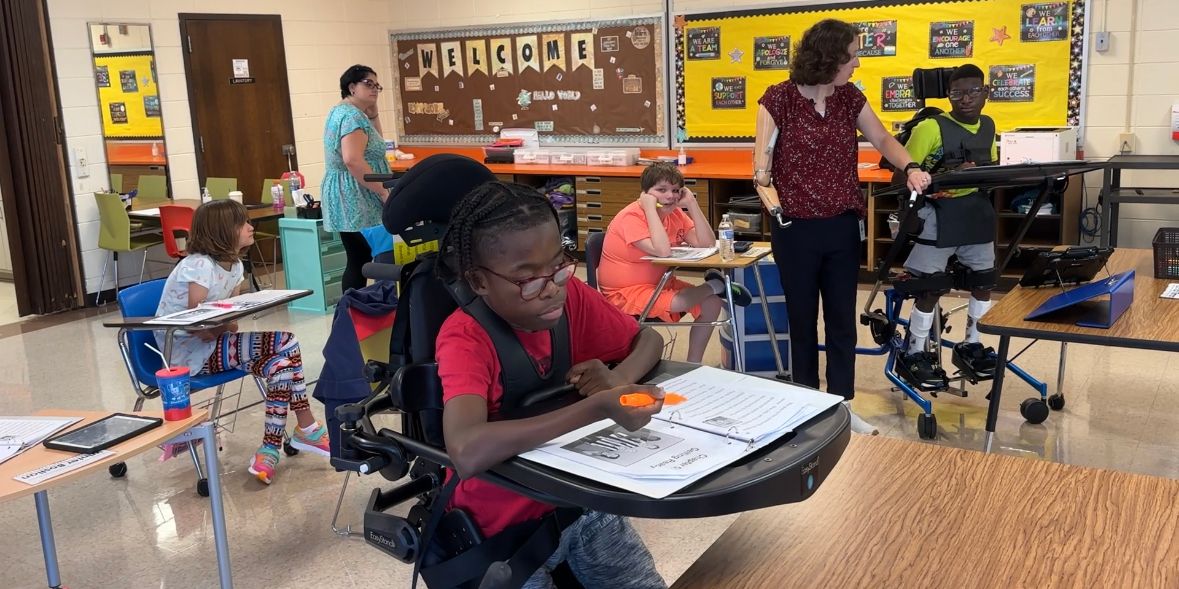 Kelli Brentnell helping her students while teaching a lesson.