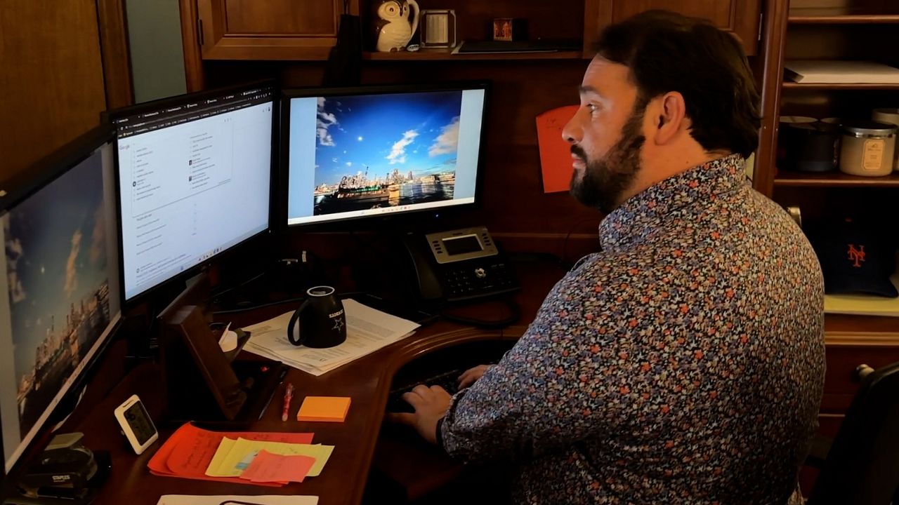 Attorney Andres Lopez helps his clients understand immigration policies. 