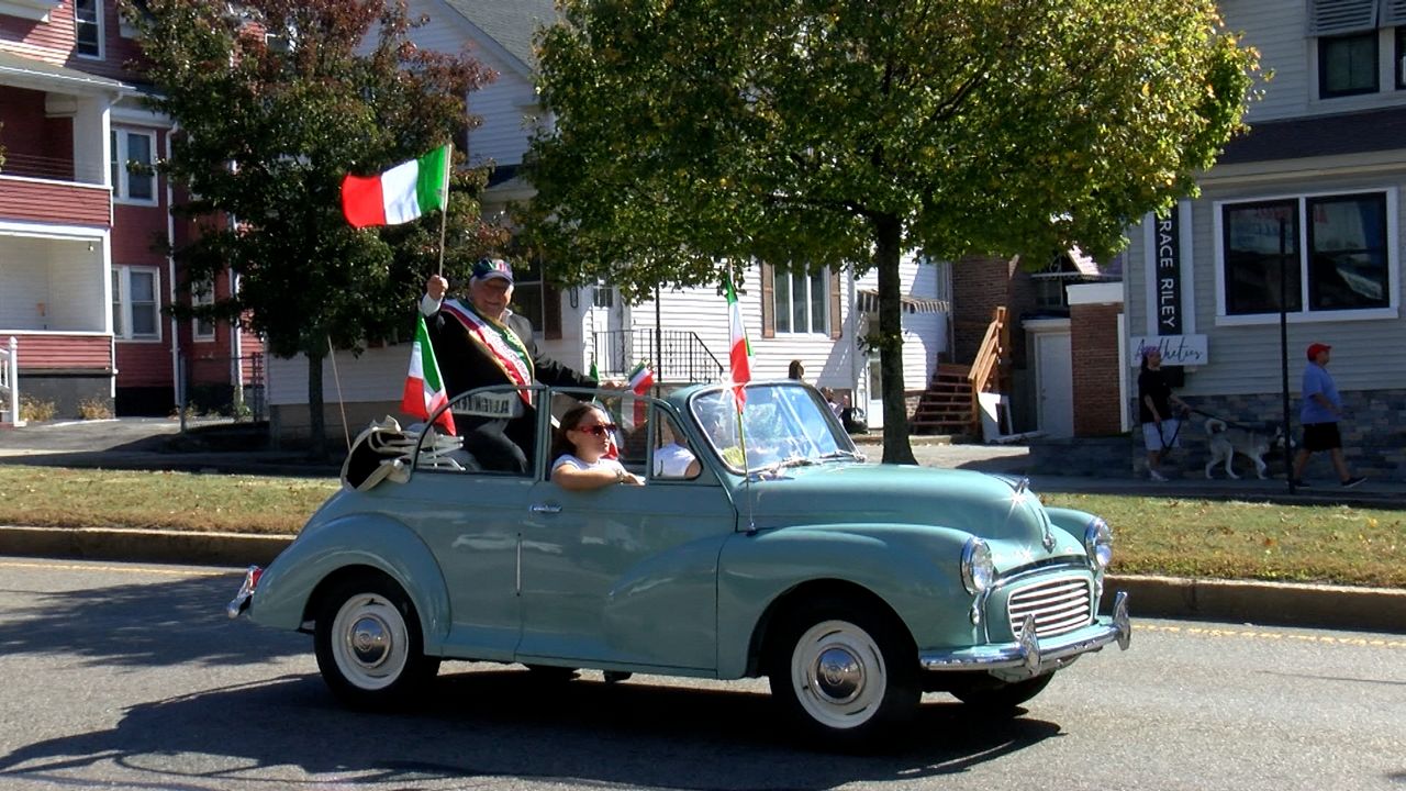 A car passes by on Shrewsbury Street for the annual Shrewsbury Street Italian Heritage Parade on Sunday. (Spectrum News 1/Devin Bates)