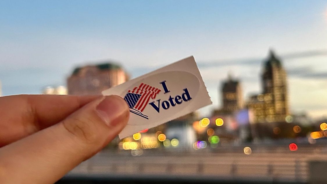 A person holds an "I Voted" sticker in this file image. (Spectrum News/FILE)