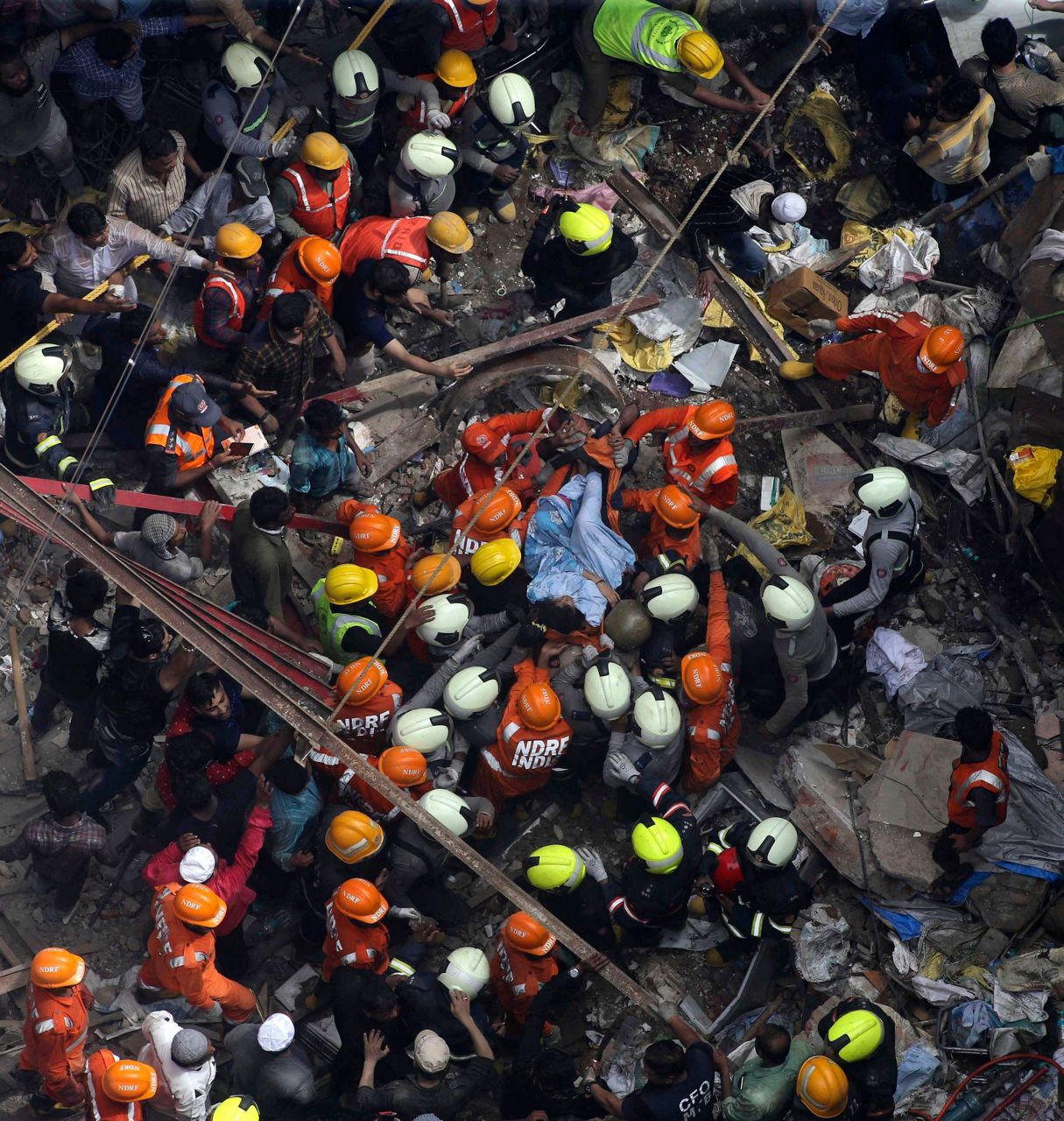 Rescuers look for survivors after building collapse in India