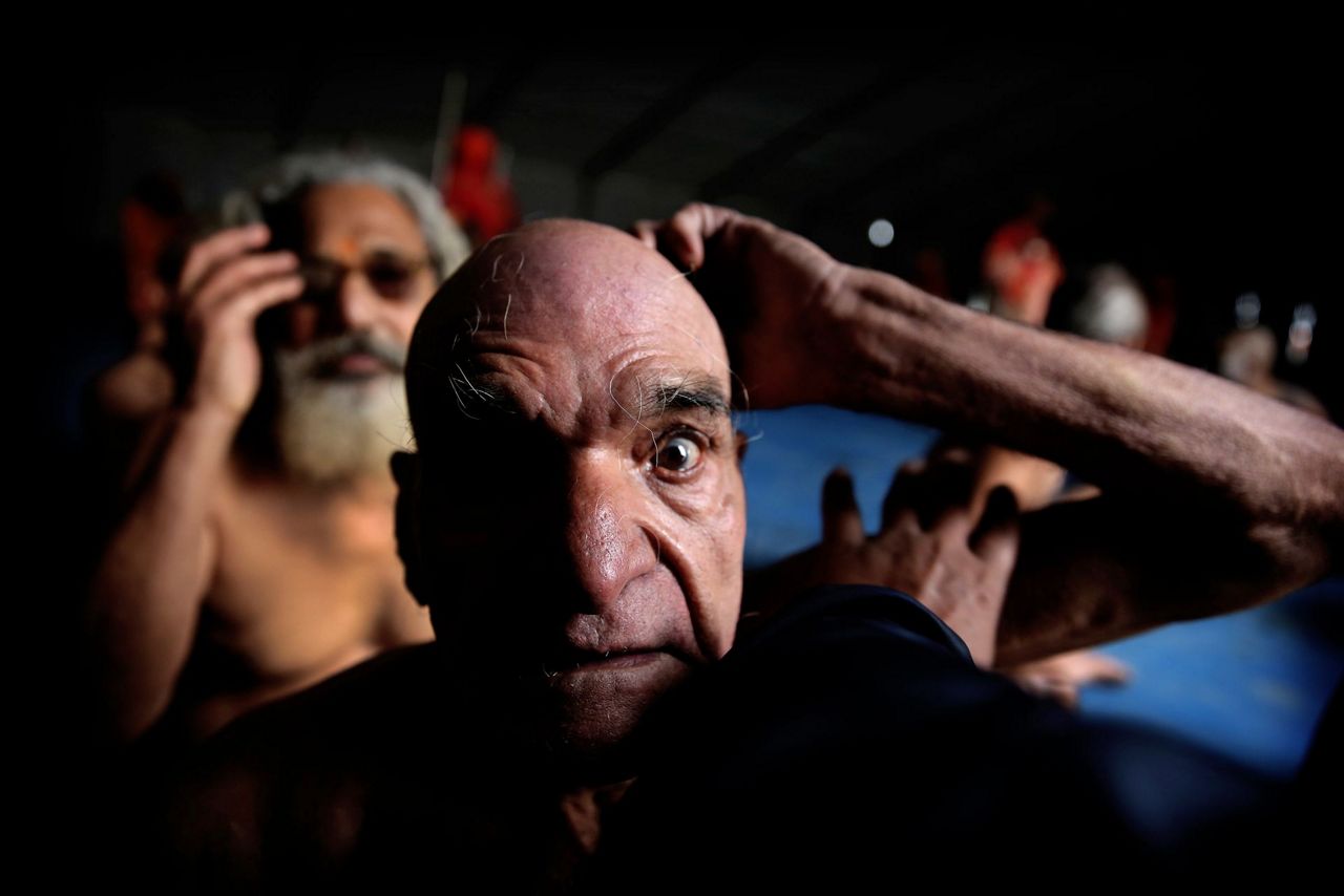 AP Photos: Naked pot-smoking sect grows at Indian Hindu fest