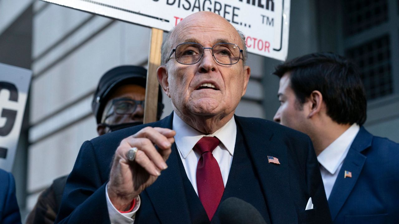 Former Mayor of New York Rudy Giuliani speaks during a news conference outside the federal courthouse in Washington, Dec. 15, 2023. (AP Photo/Jose Luis Magana, File)