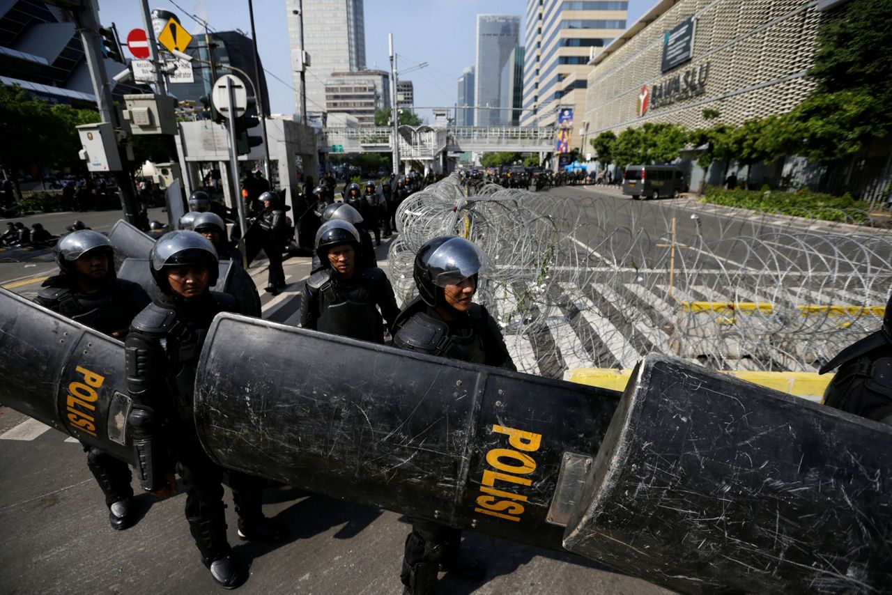 The Latest: Social media blocked due to Indonesia protests