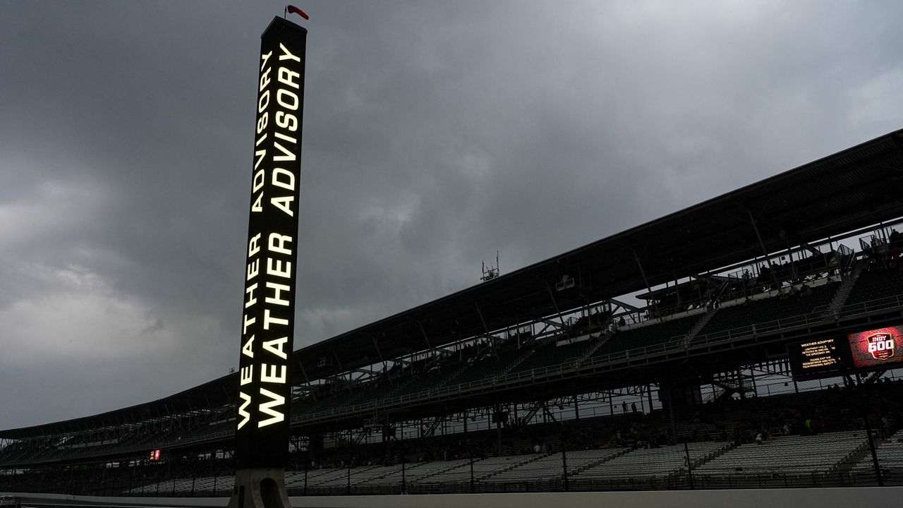 A weather advisory is posted and fans have been asked to clear the stands as storm clouds move in over the Indianapolis Motor Speedway forcing a delay for the Indianapolis 500 auto race at Indianapolis Motor Speedway in Indianapolis, Sunday, May 26, 2024. (AP Photo/Michael Conroy)