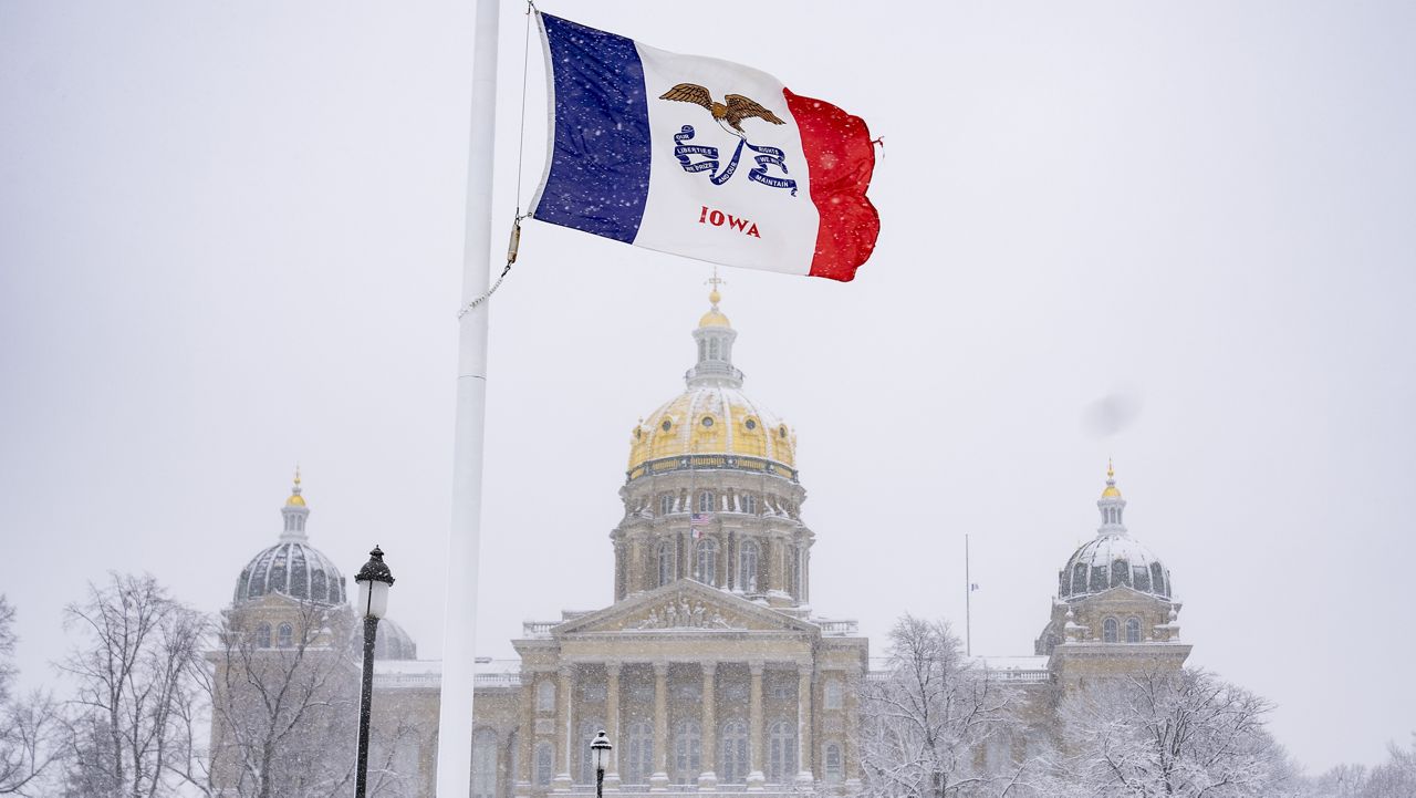Snow falls at the Iowa State Capitol Building in Des Moines, Iowa, Tuesday, Jan. 9, 2024, as a winter snow storm hits the state. (AP Photo/Andrew Harnik)