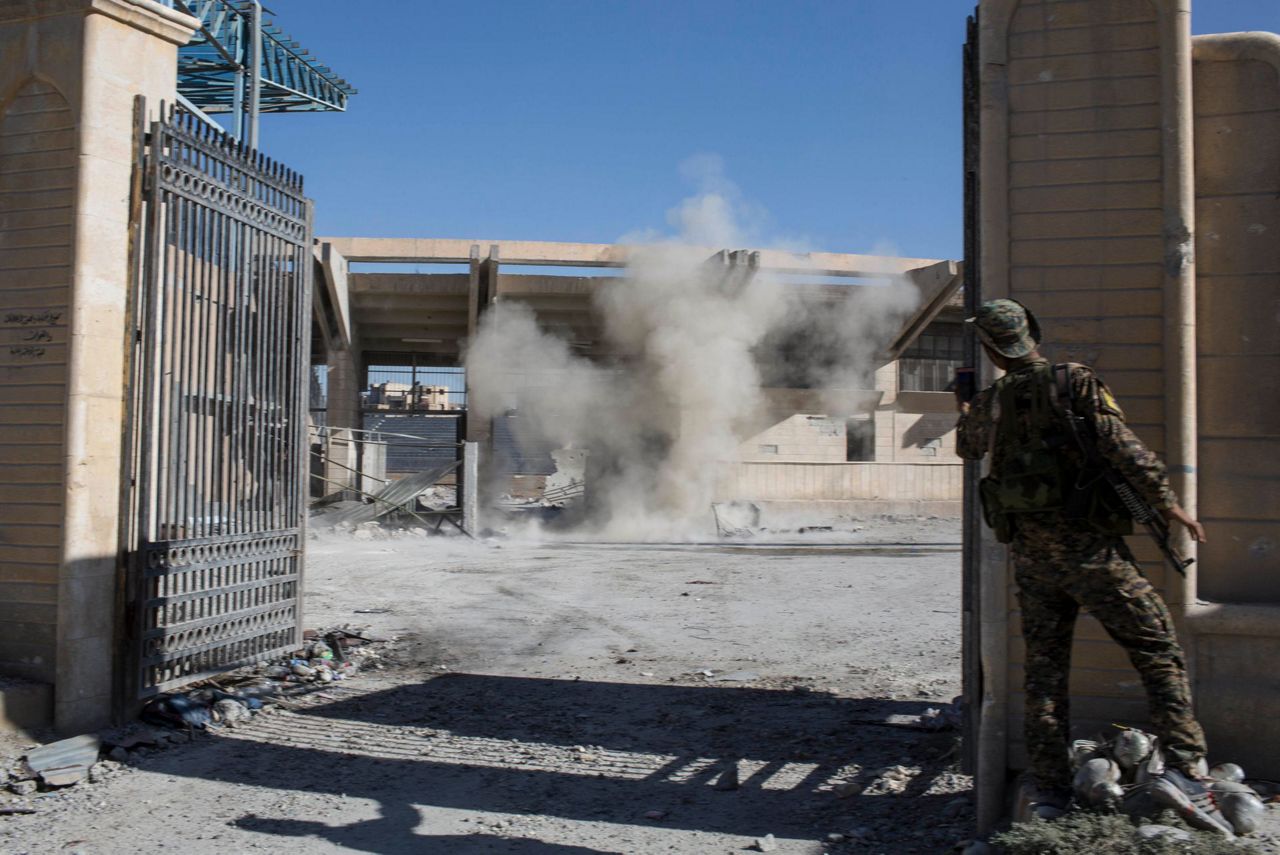 IS fights to hang on a year after defeat in Iraq