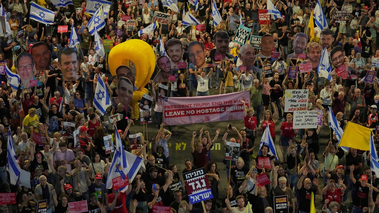 People take part in a protest demanding the end of the war and immediate release of hostages held by Hamas in the Gaza Strip, and against Prime Minister Benjamin Netanyahu's government in Tel Aviv, Saturday, May 31, 2025. (AP Photo/Ariel Schalit)