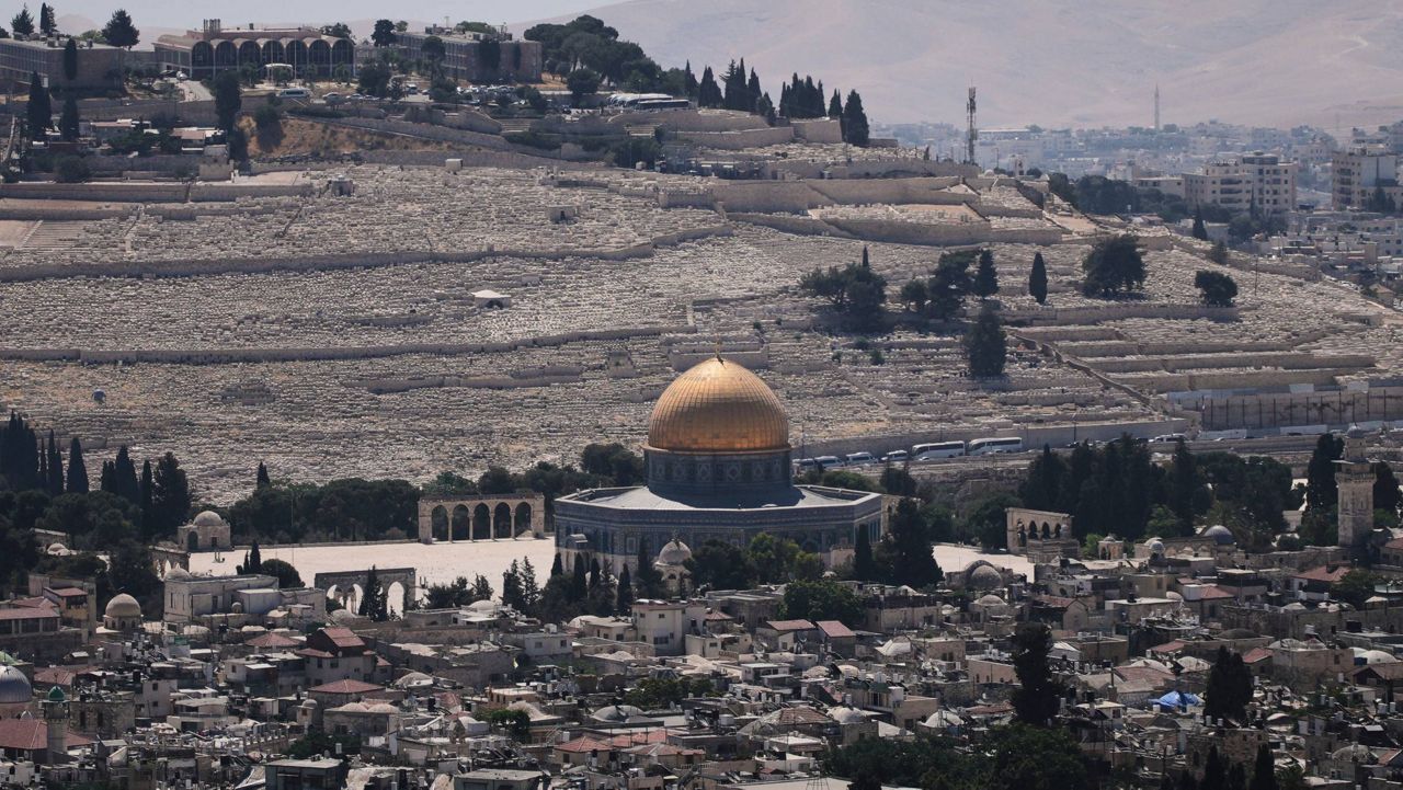 A view of Jerusalem's Old City, with the Dome of the Rock shrine in the Al-Aqsa Mosque compound, closed to worshippers after Israel's Homefront Command banned public gatherings following an Israeli military strike on Iran, Friday, June 13, 2025. (AP Photo/Ohad Zwigenberg)