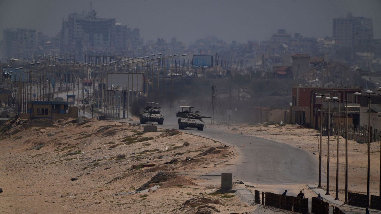 Israeli army tanks are seen in the central Gaza Strip, Saturday, May 18, 2024. (AP Photo/Abdel Kareem Hana)