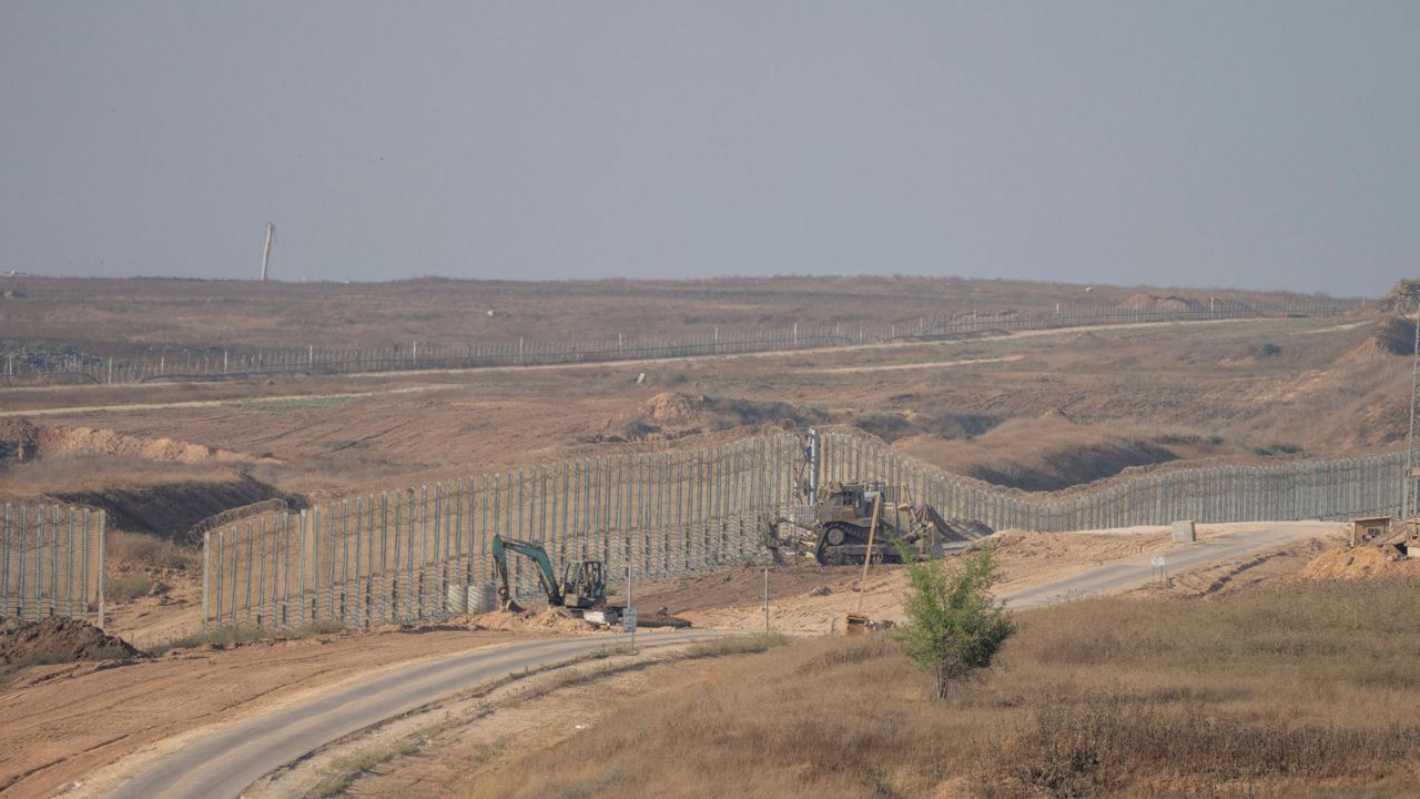 Israeli army bulldozers are seen near the Gaza Strip border, in southern Israel, Thursday, June 13, 2024. (AP Photo/Ohad Zwigenberg, File)