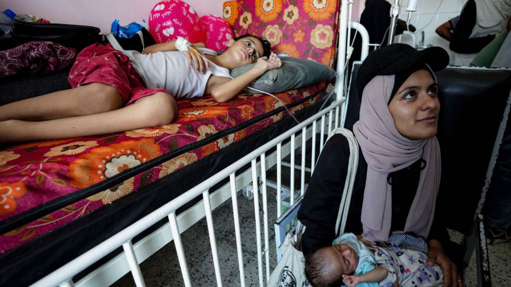 Palestinian children wait to receive a polio vaccination at a hospital in Khan Younis, Saturday, Aug. 31, 2024. (AP Photo/Abdel Kareem Hana)