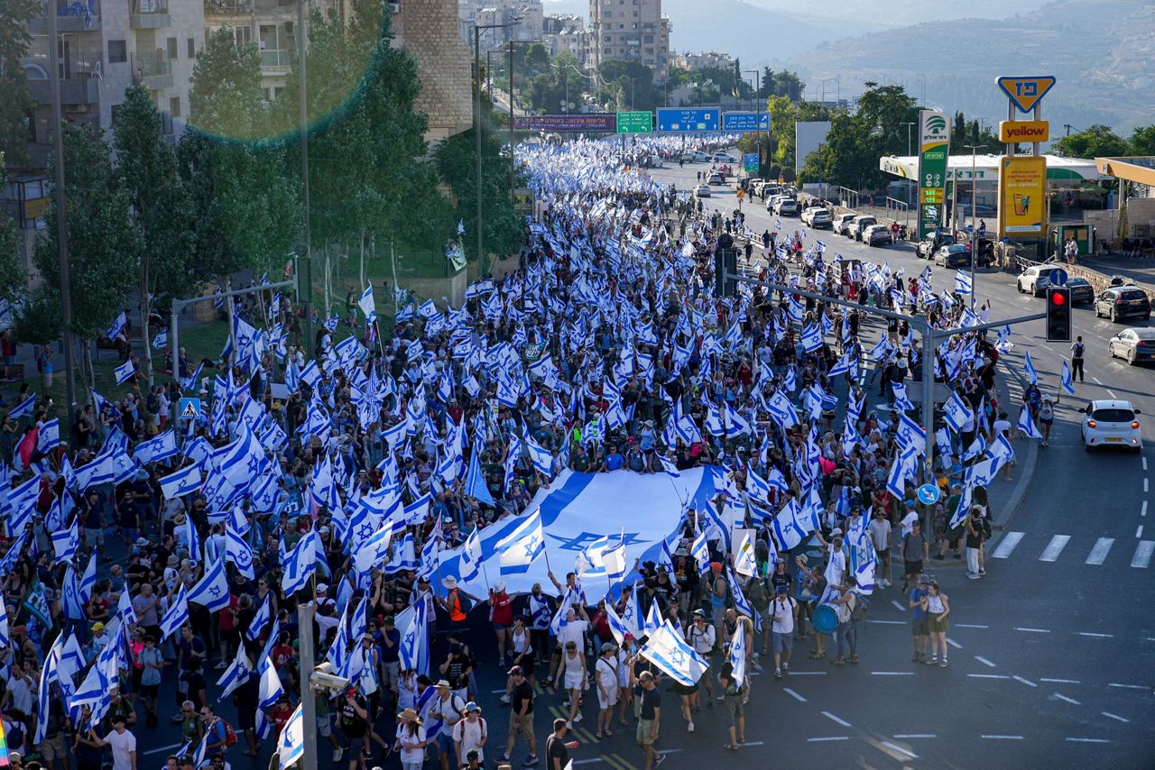 Hundreds of thousands march in Israel. Former security chiefs beg ...