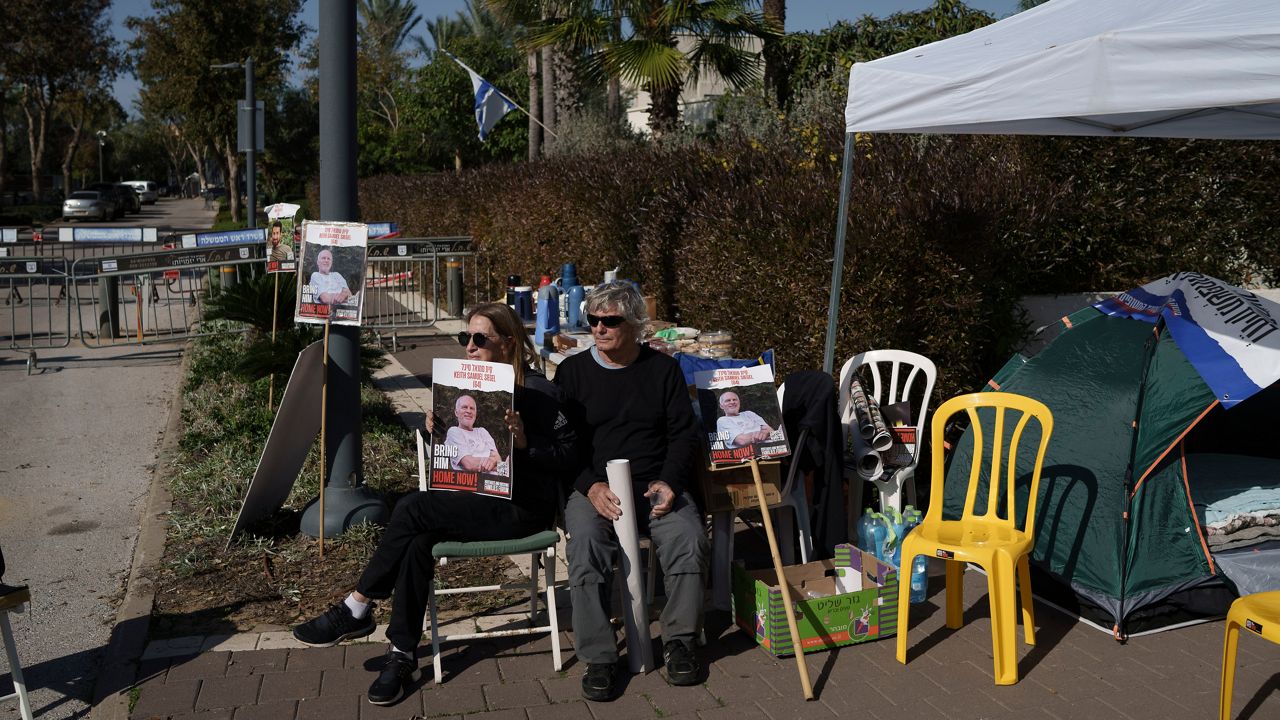 Relatives and friends of hostages sit on a camp set up outside the private residence of the Israeli Prime Minister Benjamin Netanyahu, in Caesarea, Israel, Saturday, Jan. 20, 2024, in support of a father of an Israel hostage held in Gaza who has begun a hunger strike to protest the government's lack of visible progress on a new hostage deal. (AP Photo/Leo Correa)