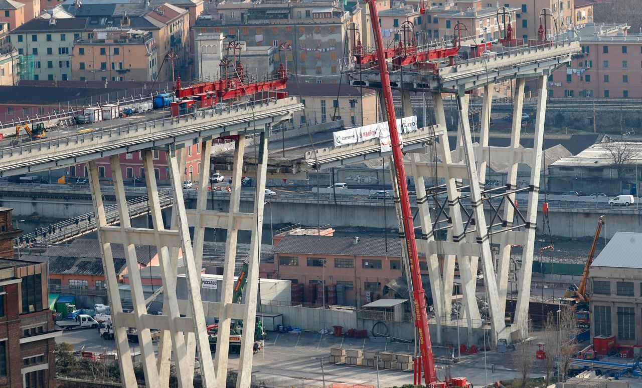 Workers carefully remove remains of collapsed Genoa bridge