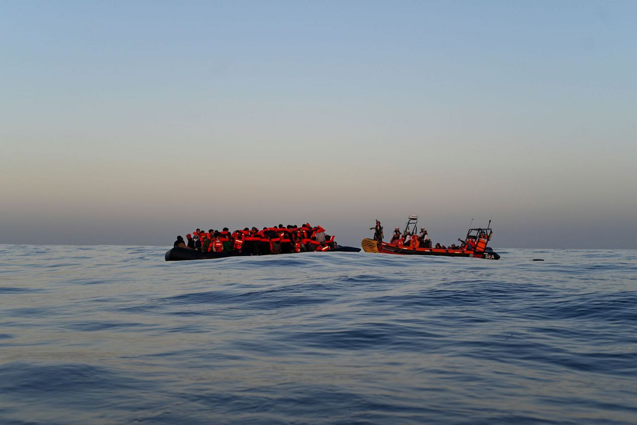 2 aid groups seek Italy port as Banksy's migrant boat docks
