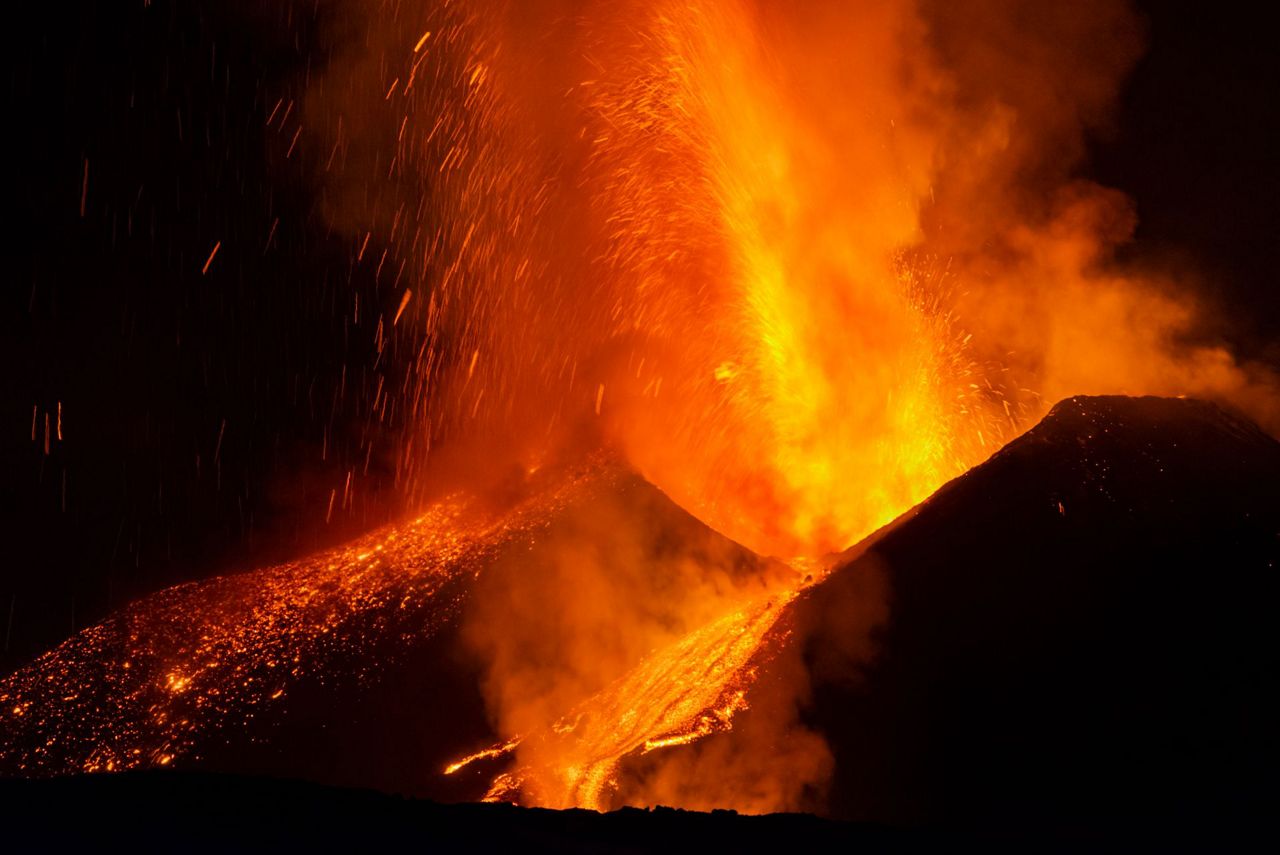 Volcanic lightning streaks sky over fiery Mount Etna