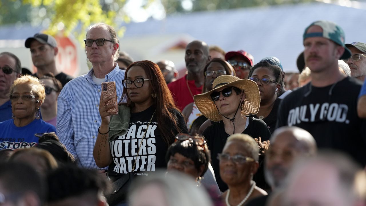 Residents of the Jacksonville community attend a prayer vigil for the victims of Saturday's mass shooting Sunday, Aug. 27, 2023, in Jacksonville, Fla. (AP Photo/John Raoux)