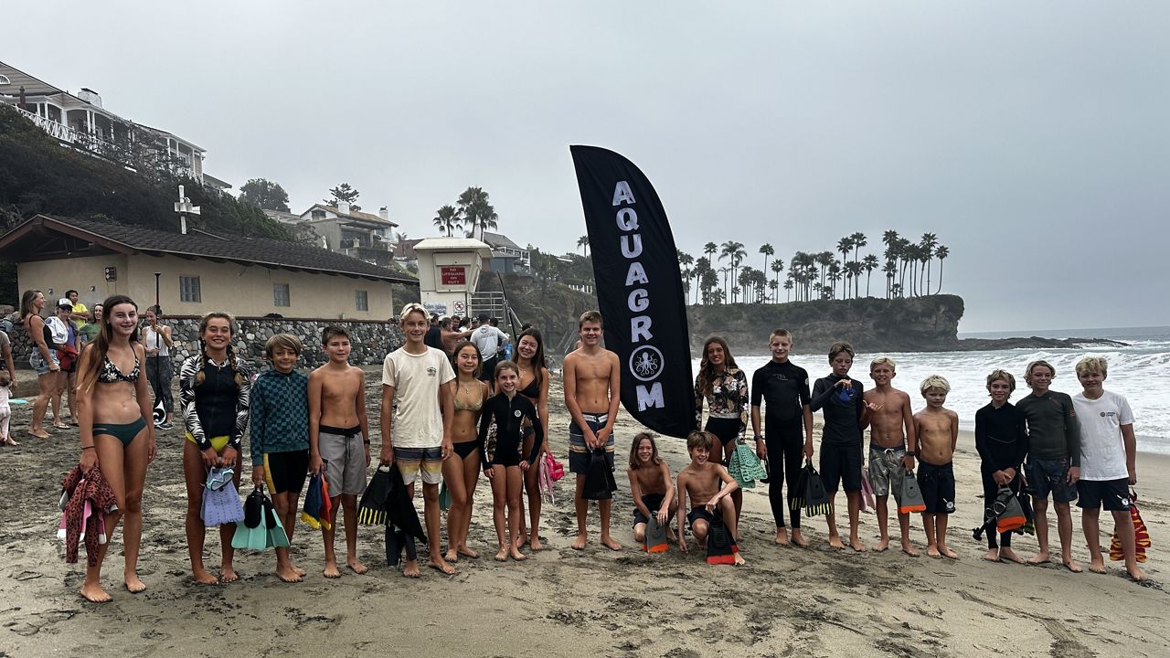Aquagroms in OC swim and stand to help protect CA from offshore oil drilling