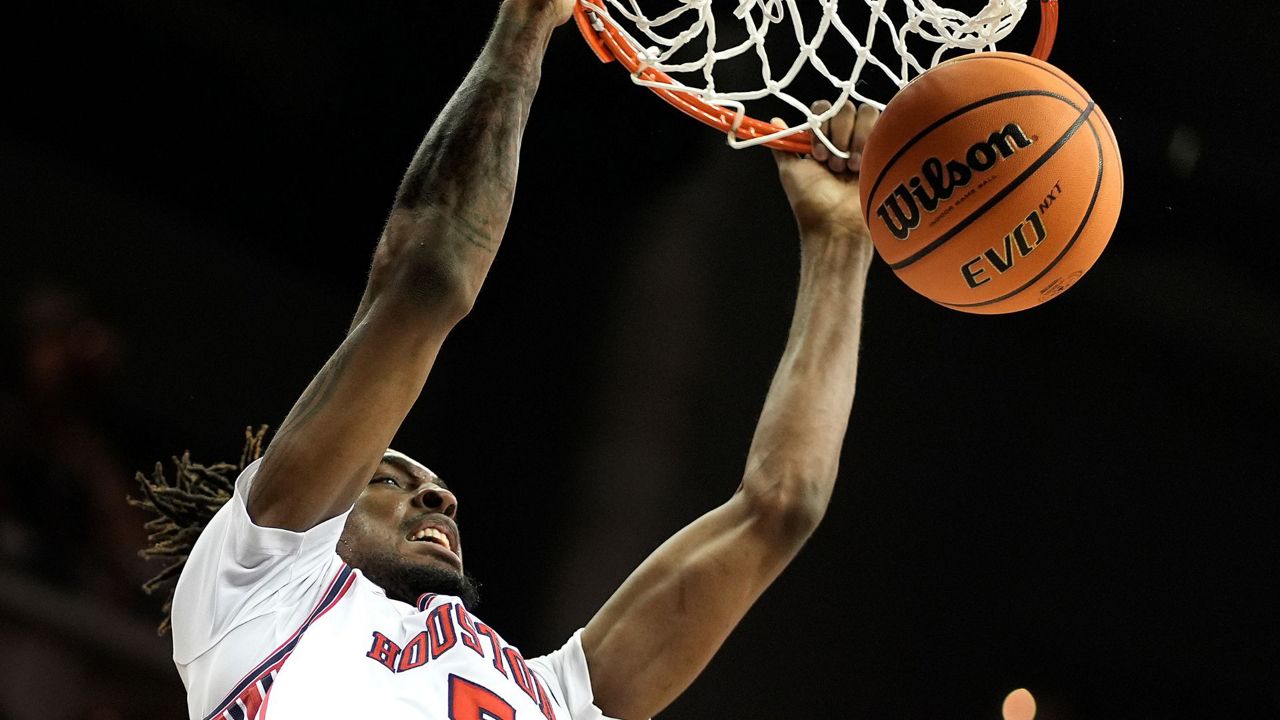Houston forward Ja'Vier Francis dunks the ball during the second half of an NCAA college basketball game against Texas Tech in the semifinal round of the Big 12 Conference tournament, Friday, March 15, 2024, in Kansas City, Mo. Houston won 82-59. (AP Photo/Charlie Riedel)