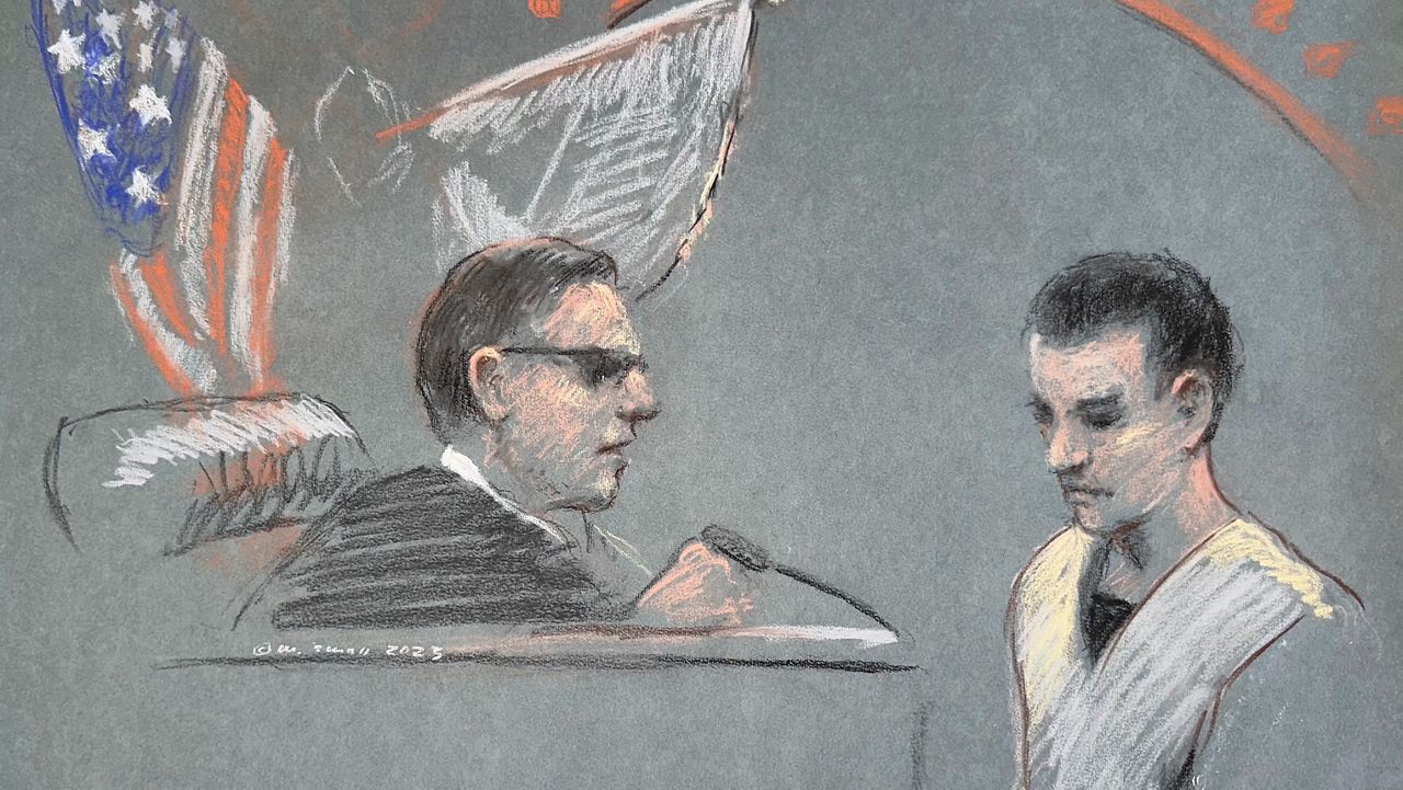 This artist depiction shows Massachusetts Air National Guardsman Jack Teixeira, right, appearing in U.S. District Court in Boston, April 14, 2023. (Margaret Small via AP)