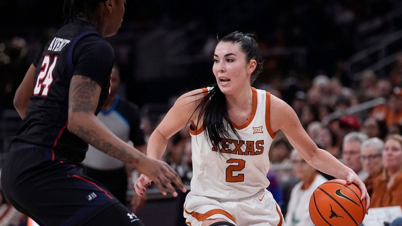 Texas guard Shaylee Gonzales (2) works the ball past Jackson State guard Andriana Avent (24) during the second half of an NCAA college basketball game in Austin, Texas, Wednesday, Dec. 27, 2023. (AP Photo/Eric Gay)