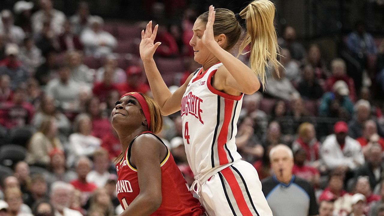 Maryland guard Bri McDaniel, left, is fouled by Ohio State guard Jacy Sheldon, right, in the first half of an NCAA college basketball game, Sunday, Feb. 25, 2024, in Columbus, Ohio. (AP Photo/Sue Ogrocki)