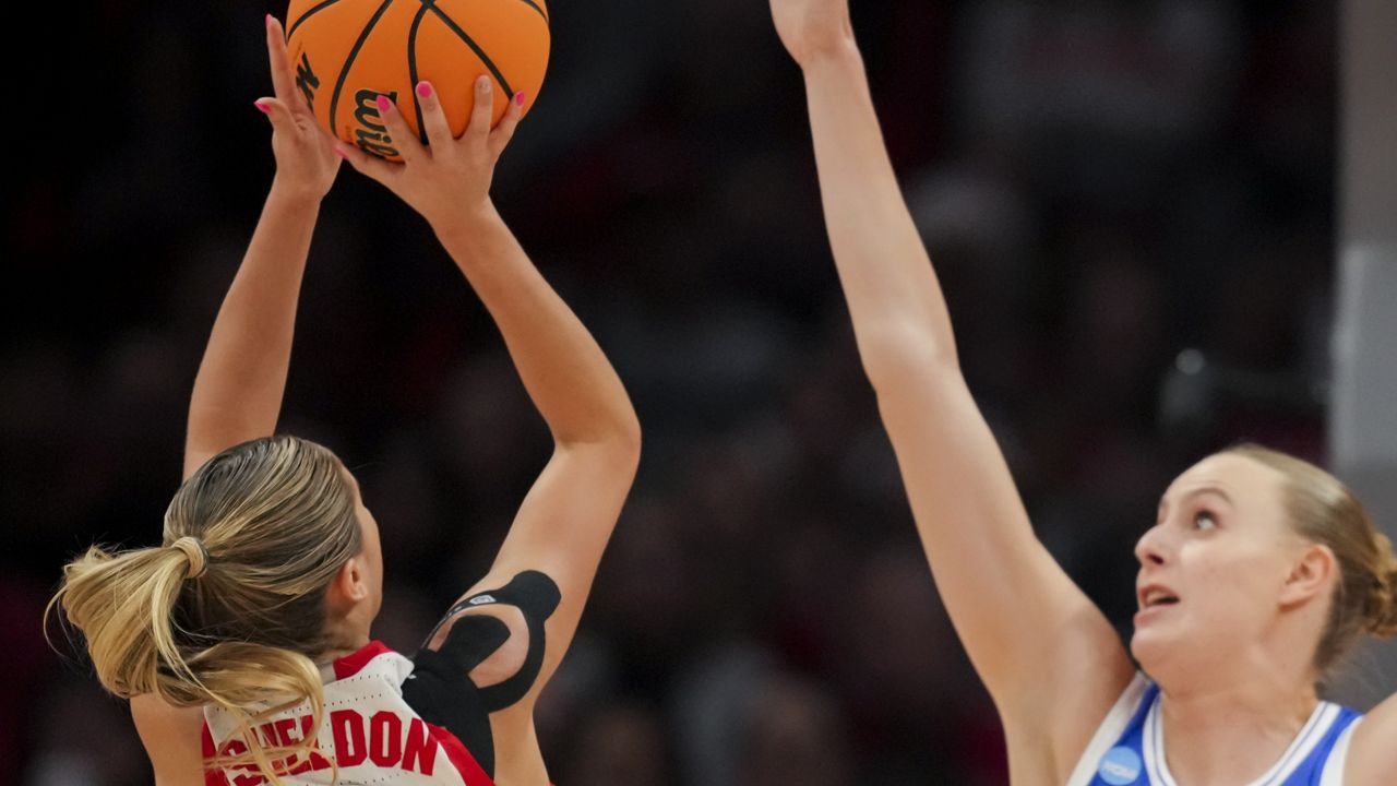 Ohio State guard Jacy Sheldon (4) shoots against Duke forward Camilla Emsbo, right, during the first half of a second-round college basketball game in the women's NCAA Tournament, Sunday, March 24, 2024, in Columbus, Ohio. (AP Photo/Aaron Doster)