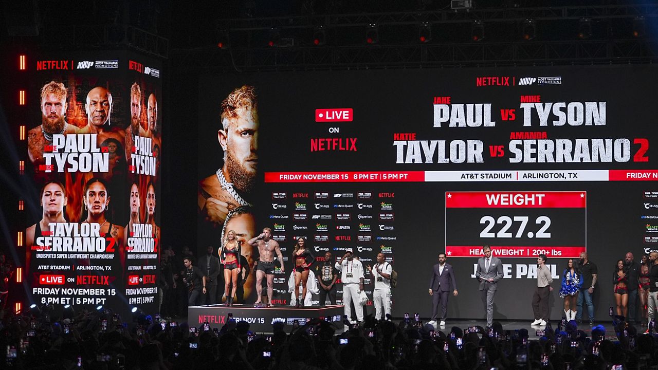 Jake Paul steps on the scale during a weigh-in ahead of his heavyweight bout against Mike Tyson, Thursday, Nov. 14, 2024, in Irving, Texas. (AP Photo/Julio Cortez)