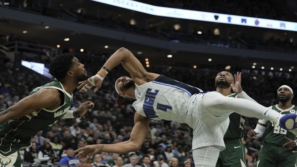 Orlando guard Jalen Suggs is fouled in the first half against Milwaukee on Wednesday night.