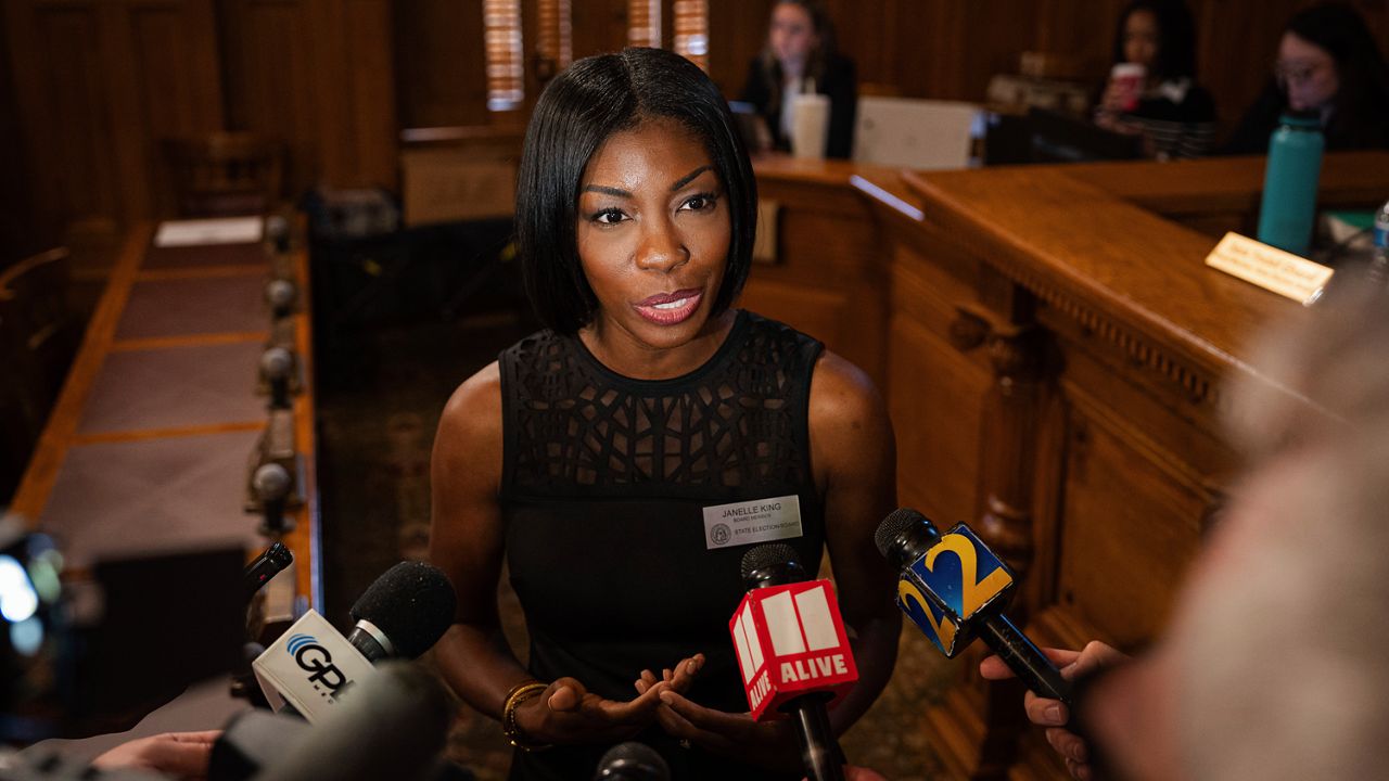 Janelle King, a member of the State Election Board, takes questions from the media during a brief recess during a meeting at the Capitol in Atlanta, Tuesday, Aug. 6, 2024. (Matthew Pearson/WABE via AP)