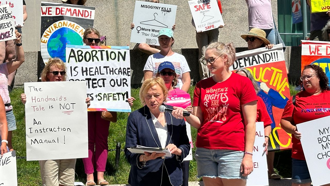 Gov. Janet Mills fires up the crowd in Monument Square Monday on the two year anniversary of the U.S. Supreme Court decision on abortion. (Spectrum News/Susan Cover)