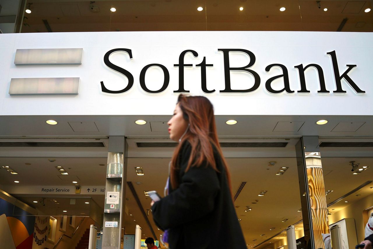 Japan's tech investor SoftBank trims losses and promises offensive