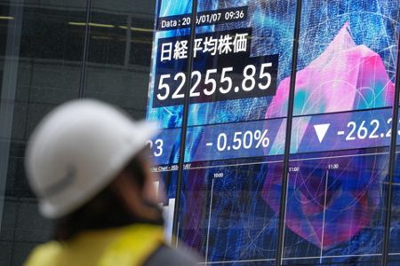 Global shares trade mixed after Wall Street hits records on tech gains