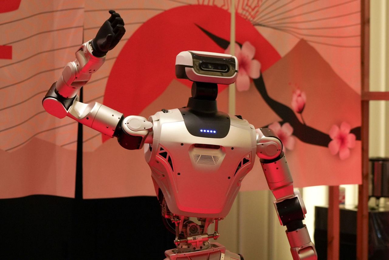 Humanoids dance and thread needles as Japanese robotics developers look ...