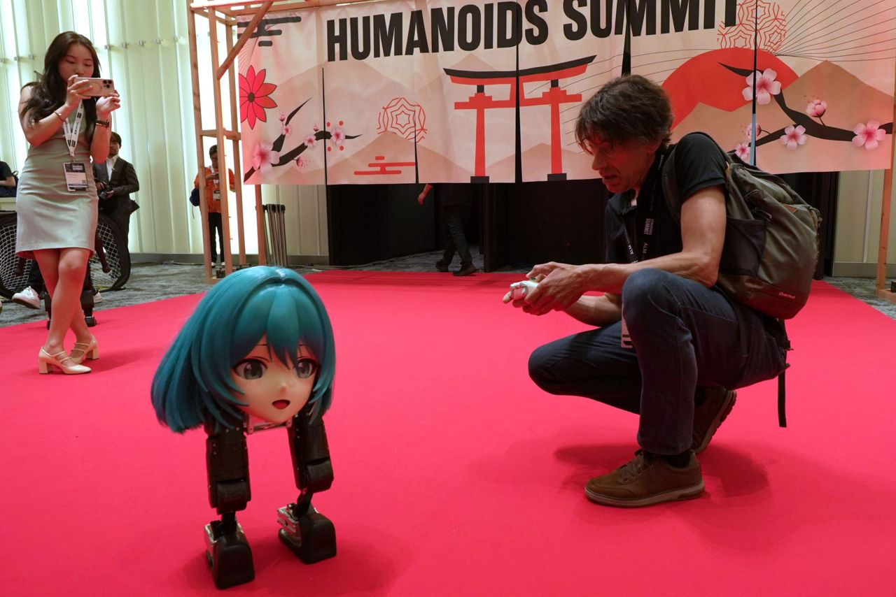 Humanoids dance and thread needles as Japanese robotics developers look ...